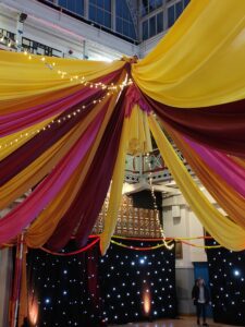 Multiple coloured ceiling drape in London Scottish house.