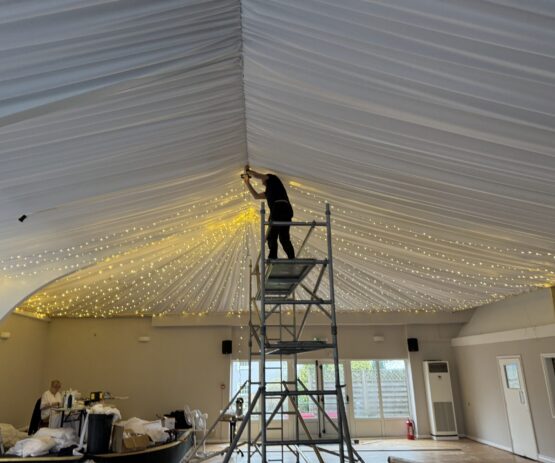 IMG_0248 Permanent installation for a wedding venue with fairy lights and wall drapes.
