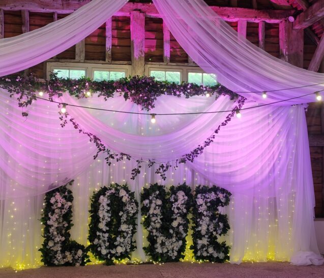 Wedding backdrop, fairy lights garland and drapes