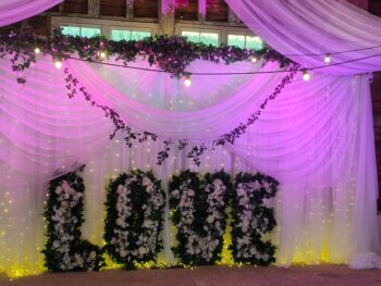 wedding Backdrop with foliage and love sign