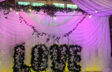 wedding Backdrop with foliage and love sign